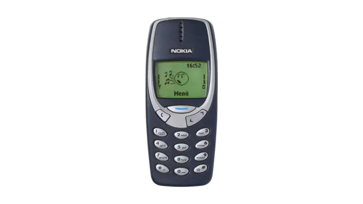 A classic Nokia 3310 handset with its monochrome screen and rubber keypad, the design that carried Nokia to the top of the mobile phone market.