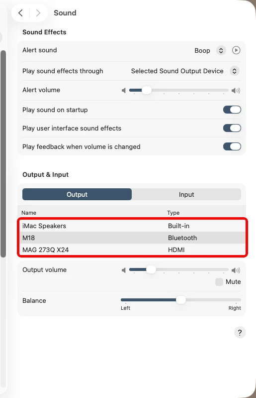 macOS Sound settings Output tab with the device list highlighted